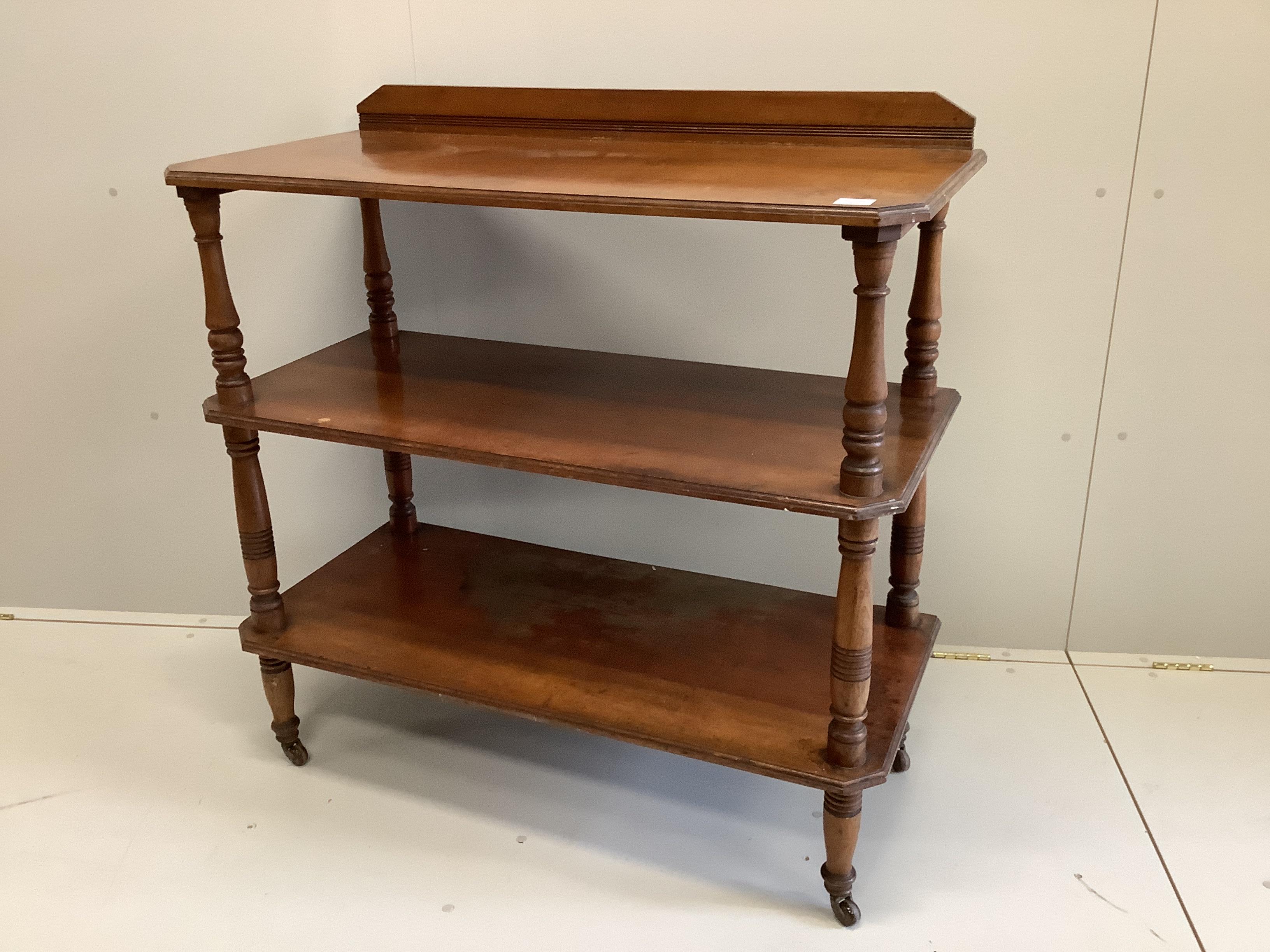 A late Victorian walnut three tier buffet, width 106cm, depth 51cm, height 107cm